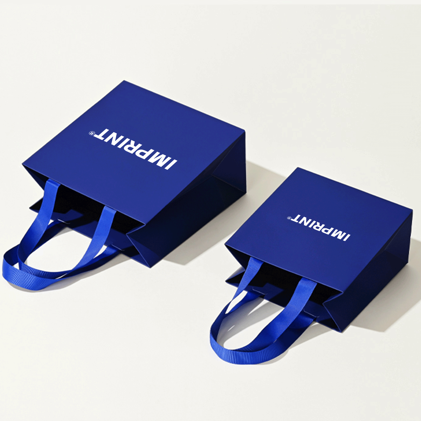 Custom Deep Blue Laminated Paper Bag with Grosgrain Handles – IMPRINT®